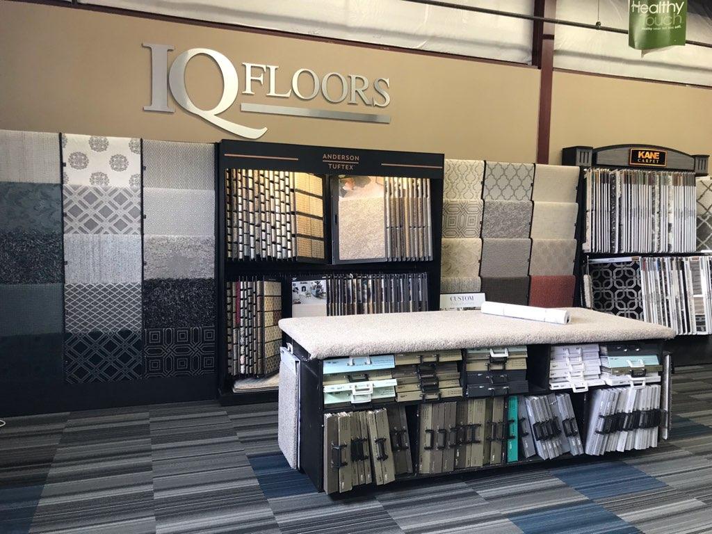  IQ Floors showroom with 3D lettering and flooring samples